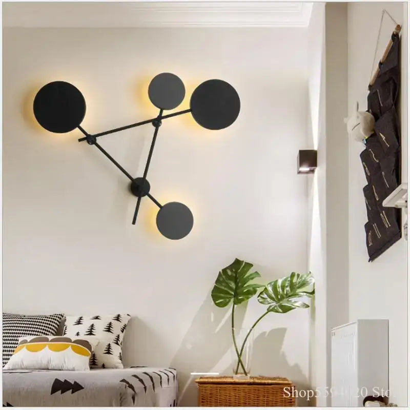 Modern black geometric iron wall lamp with circular light fixtures for stylish living room decorbites geometric iron wall