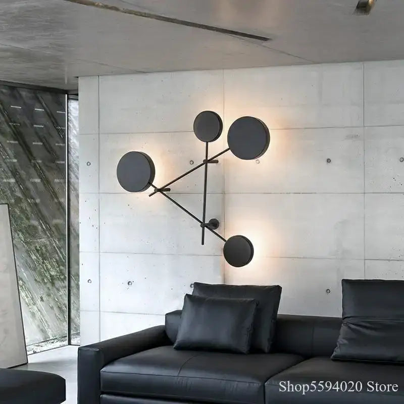 Modern black geometric iron wall lamp with four circular light fixtures for stylish living room decorbites geometric iron wall