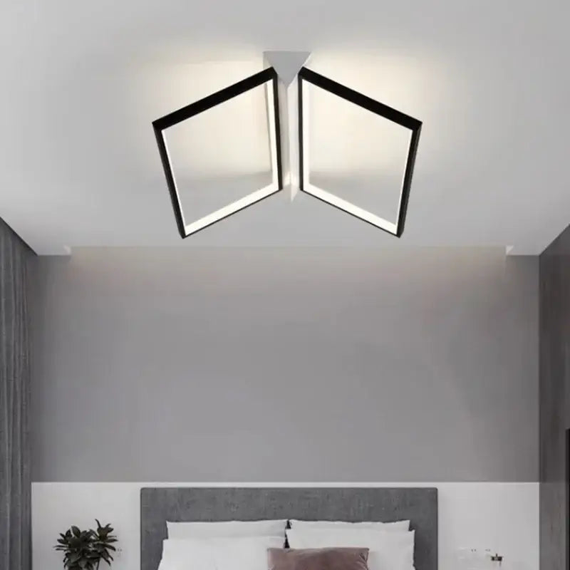 Modern black geometric led ceiling lights with two square panels emitting a warm glow for living room illumination