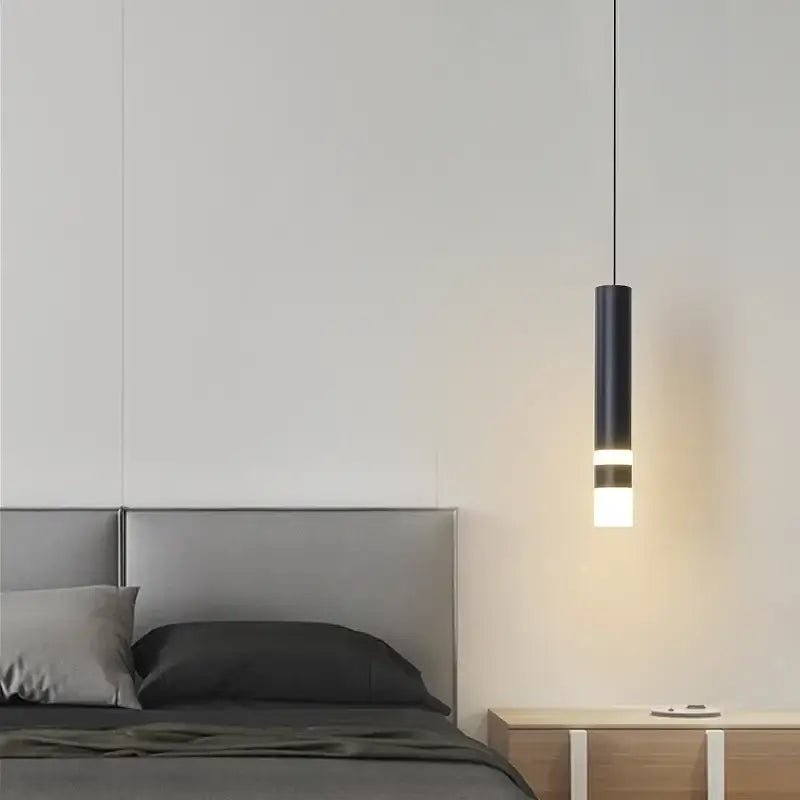 Modern black geometric led pendant light with a glowing white band designed for living room decorbites pendant lights