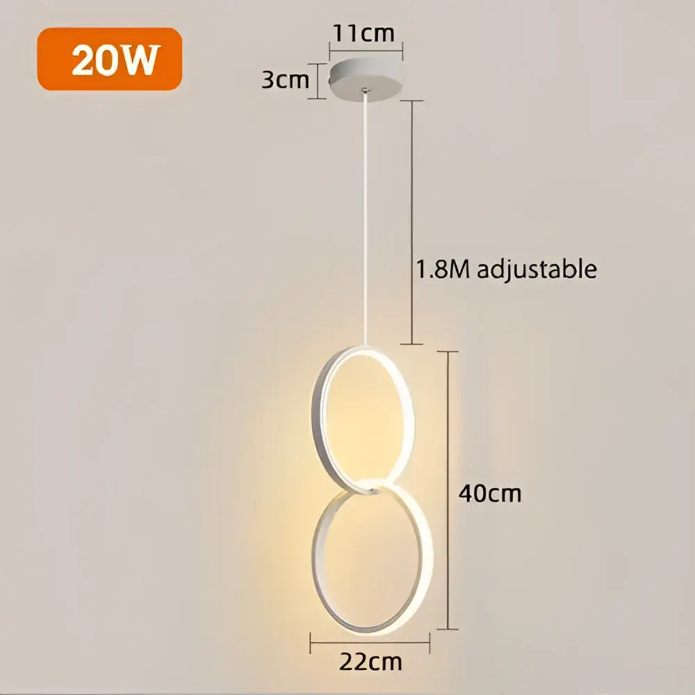 Modern black geometric led pendant light with two interlocking rings emitting warm glow for living room decorbites pendant lights