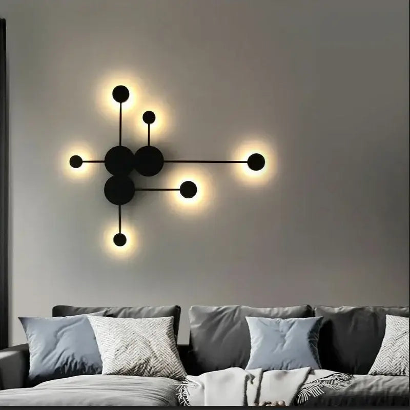 Modern black geometric led wall lamp with glowing circular lights designed as a minimalist bedroom led wall sconce