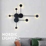 Modern black geometric led wall lamp with minimalist circular fixtures designed as a led wall sconce for bedroom use