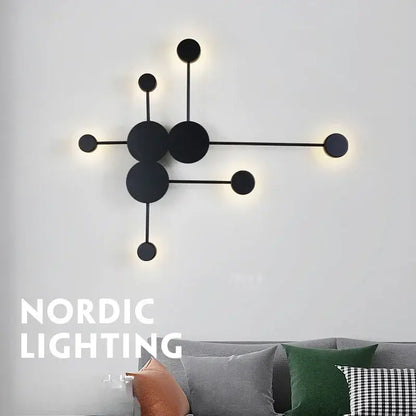 Modern black geometric led wall lamp with minimalist circular fixtures designed as a led wall sconce for bedroom use