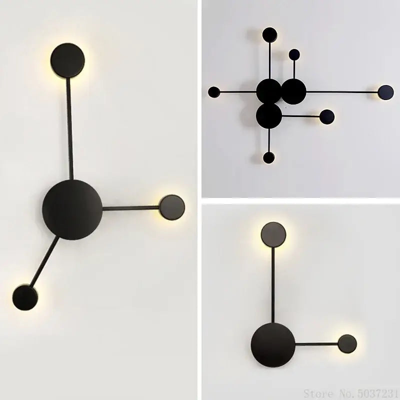 Modern black geometric led wall lamp featuring minimalist circular elements and slender rods emitting warm glow