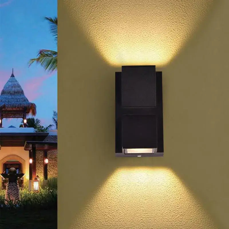 Modern black geometric led wall lamps with two angled panels casting warm yellow light for outdoor decorbites led wall use