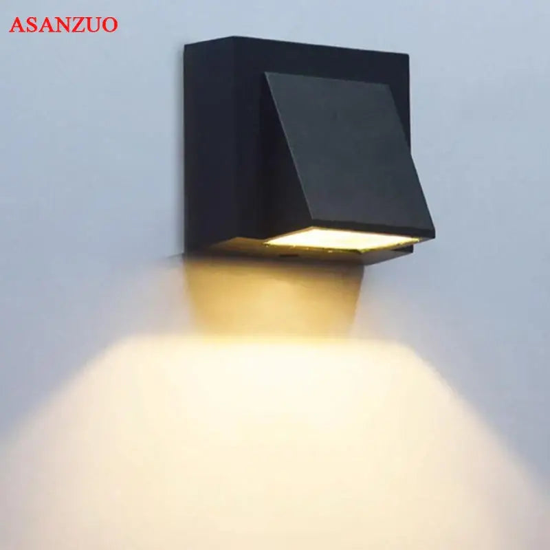 Modern black geometric led wall lamps with warm yellow illumination for outdoor decorbites led wall lighting
