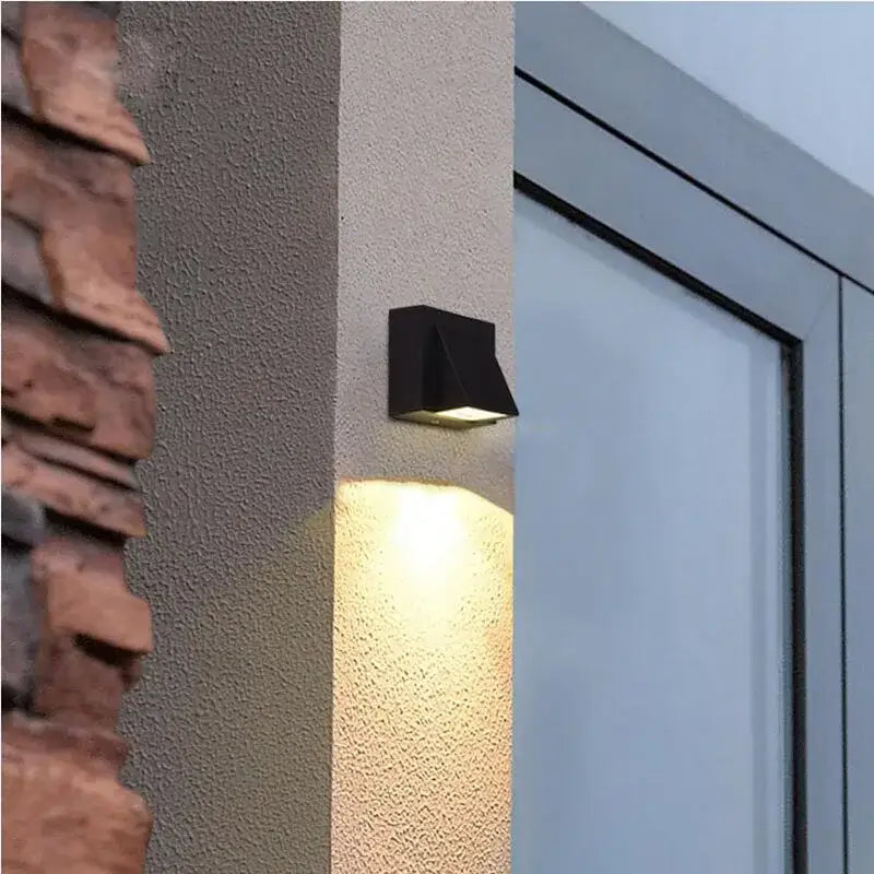 Modern black geometric led wall lamps with a matte finish casting warm light for outdoor decorbites led wall use