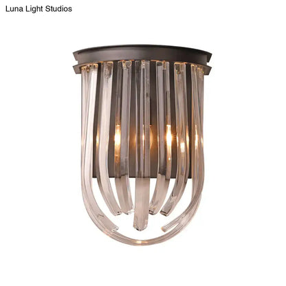 A modern semi oval wall light with black finish featuring dark bronze metal and clear curved glass rods for bedroom use