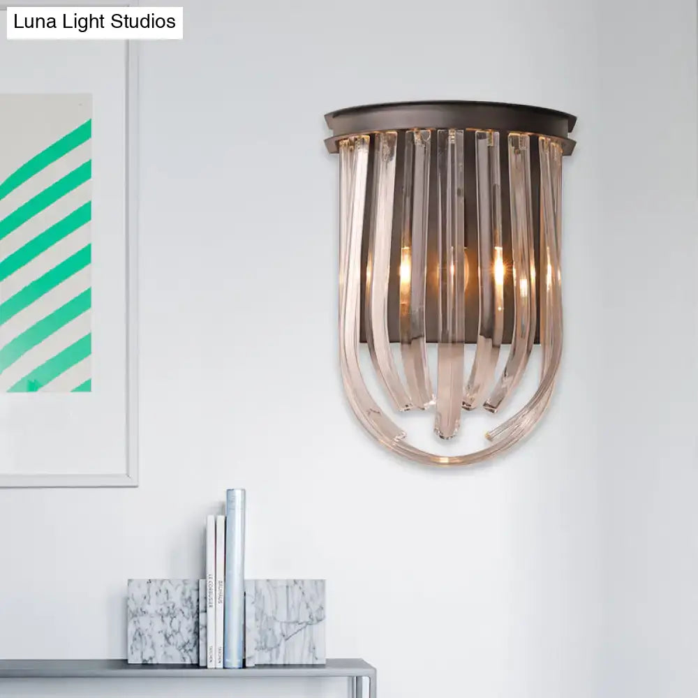 A modern semi oval wall light with a black finish featuring dark bronze frame and cascading translucent glass rods