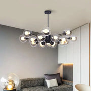 Modern black metal chandelier with multiple clear glass globe bulbs for dining room decorbites glass ball led lighting