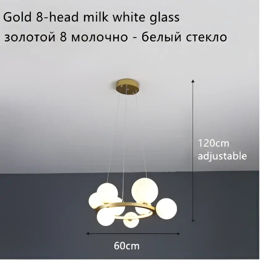 Modern gold-toned ball led chandelier with eight frosted glass balls suspended on a circular frame for dining room