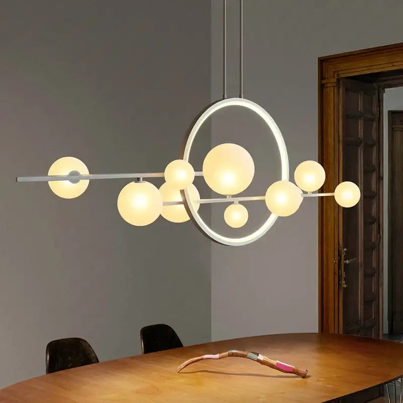 Modern black glass ball led chandelier featuring a sleek white metal frame with asymmetrical glowing glass ball led bulbs for dining room decorbites glass ball lighting