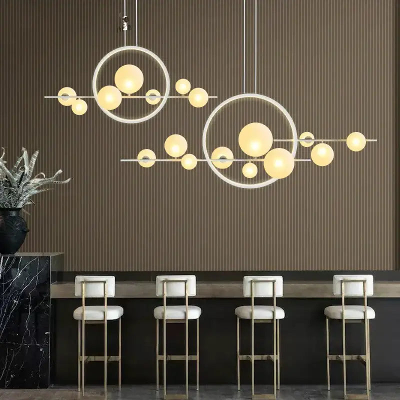 Modern black glass ball led chandelier with warm glowing glass ball led bulbs on sleek white metal frames for dining room decorbites