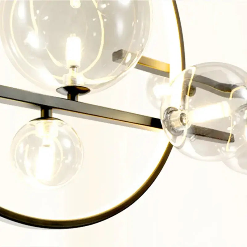 Modern brass-toned ball led chandelier with clear glass globe bulbs for dining room lighting decorbites glass ball design