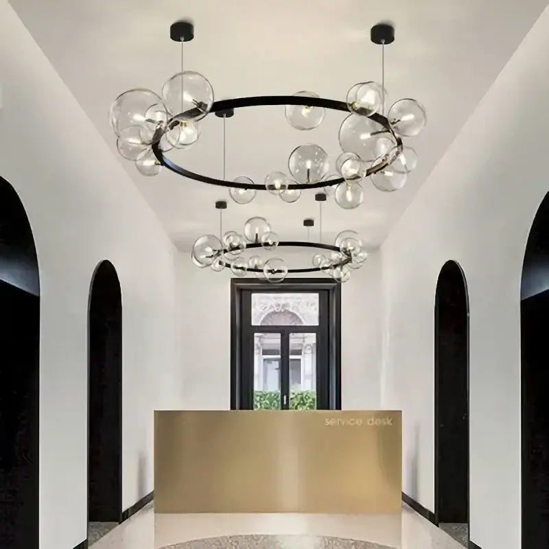 Modern black metal ball led chandelier featuring clear glass ball led bulbs for dining room lighting