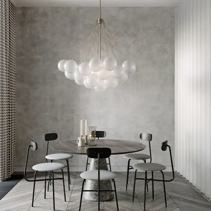 Modern black glass ball led chandelier with translucent white spherical bulbs suspended on a metallic frame for living room decorbites glass ball