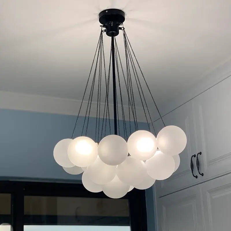 Modern black metal ball led chandelier with frosted glass spheres suspended by chains for living room decorbites glass ball