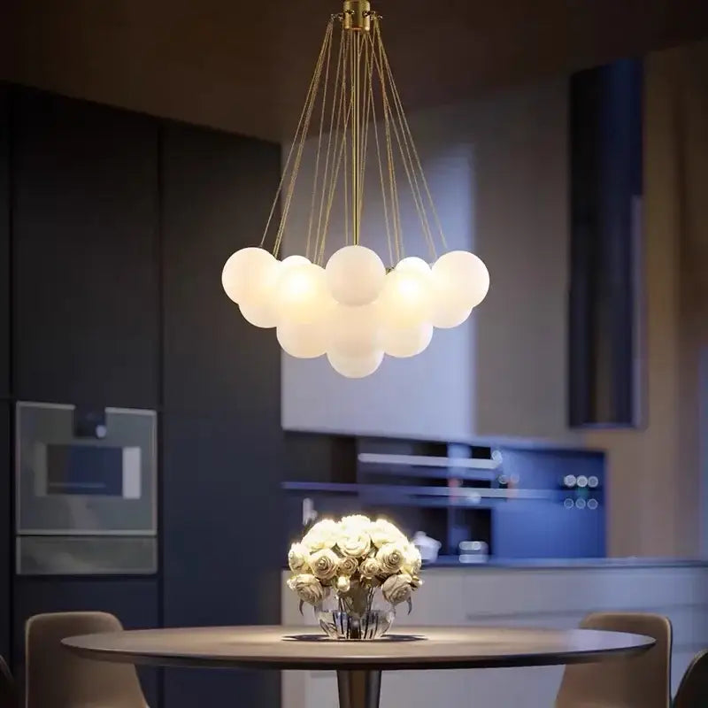 A modern black glass ball led chandelier featuring frosted glass spheres with gold-toned cords for living room decorbites glass ball