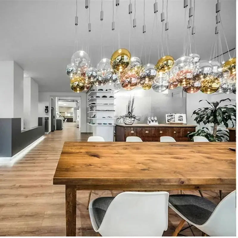Modern black glass ball led pendant lamps featuring spherical glass orbs in gold silver and rose gold finishes for dining decorbites glass ball