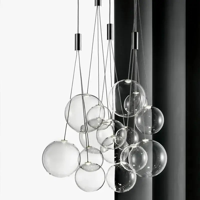 Modern black glass ball led pendant lamps with clear spherical bulbs suspended by thin metallic cords for kitchen decorbites glass ball design