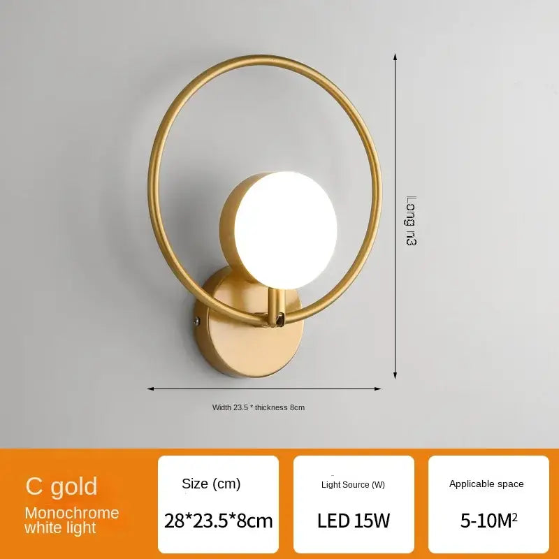 Modern black glass ball led wall lamp featuring a gold-toned circular minimalist wall lamp with led light source