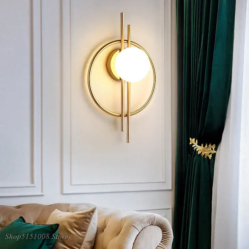 Modern gold-toned wall lamp with decorbites glass ball led featuring frosted globe for living room decor