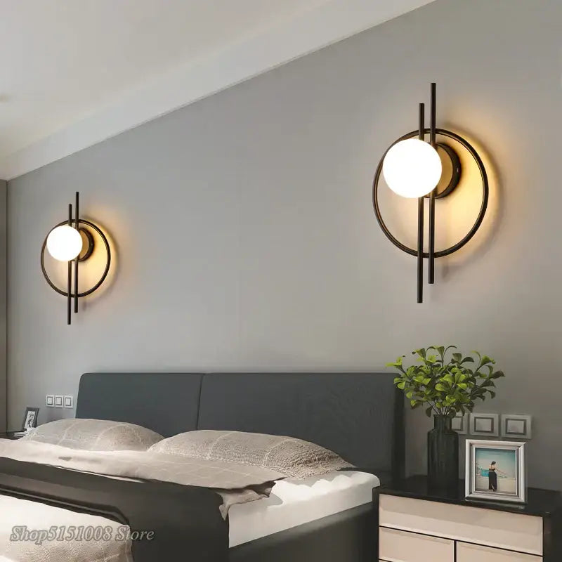 Modern black glass ball led wall lamp with circular frame and warm glowing bulb for living room decorbites glass ball design