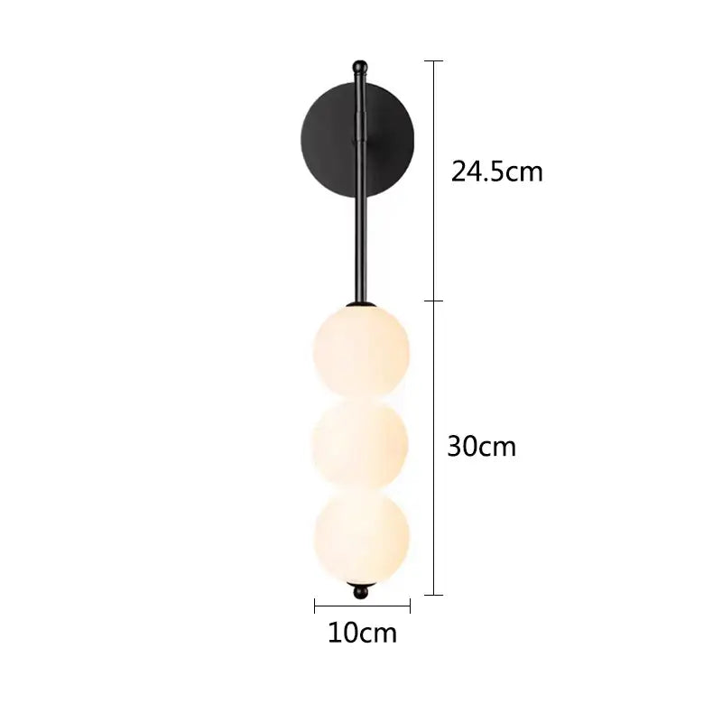 Modern black wall sconce with three stacked off-white glass spheres for decorbites glass ball led living room decor