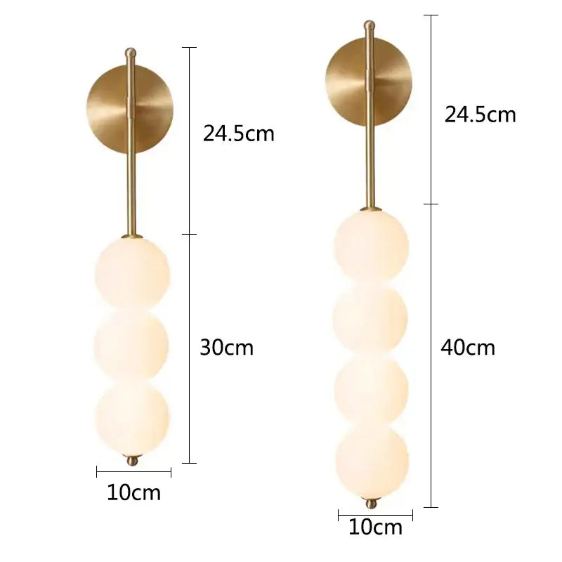 Modern gold-toned wall sconce with three frosted glass spheres stacked vertically for decorbites glass ball led use