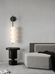 Modern black glass ball led wall sconce with four glowing spherical bulbs for living room decor by decorbites glass ball