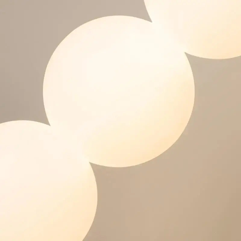 Modern black glass ball led wall sconce with soft glowing off white glass ball lighting for living room decorbites decor