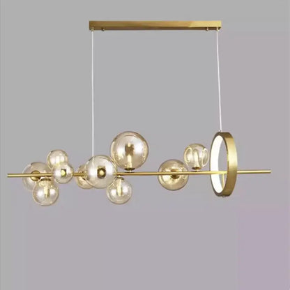 Modern gold-toned pendant lamps with sleek horizontal bar, decorbites glass ball spheres, and integrated ring light chandelier