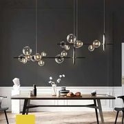 Modern black metal pendant lamps with clear glass ball pendant bulbs suspended by thin cords for dining room decorbites chandelier