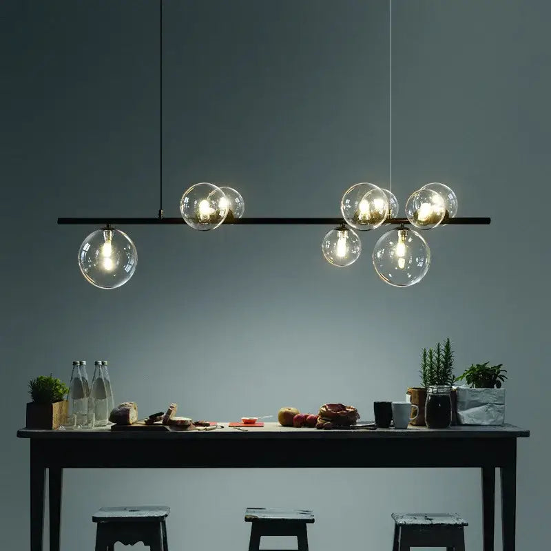 Modern black metal glass ball pendant light chandelier with clear glass globe bulbs for dining room decorbites pendant light