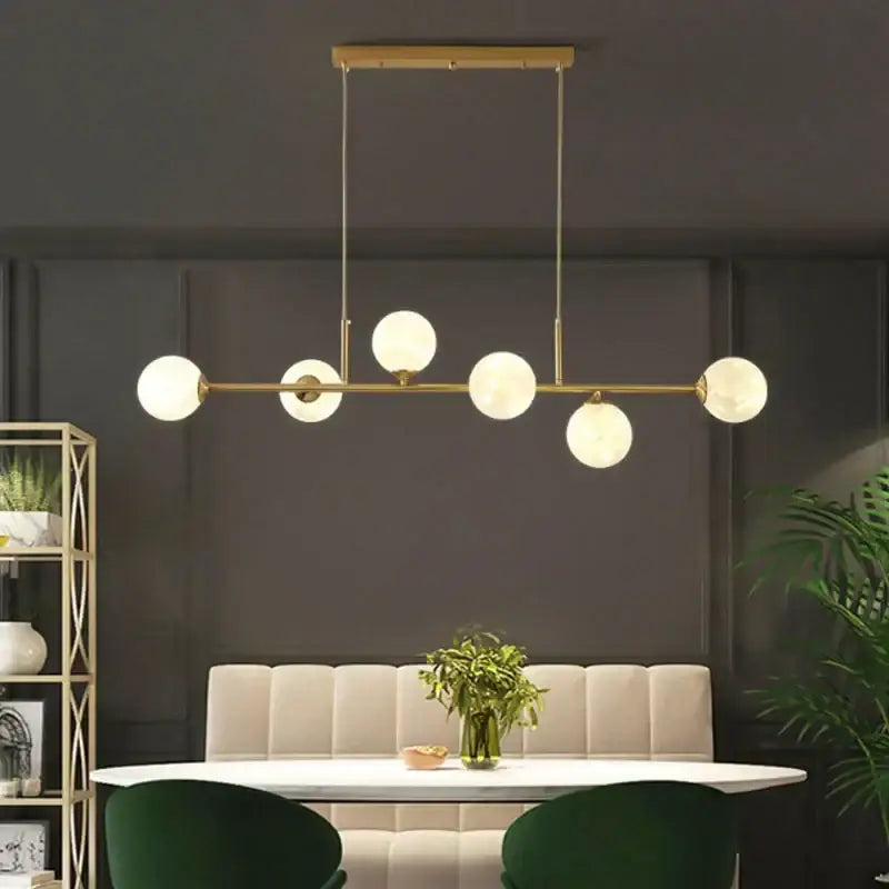 Modern black glass ball pendant light with five frosted glass globe bulbs in brass linear design for living room decorbites chandelier