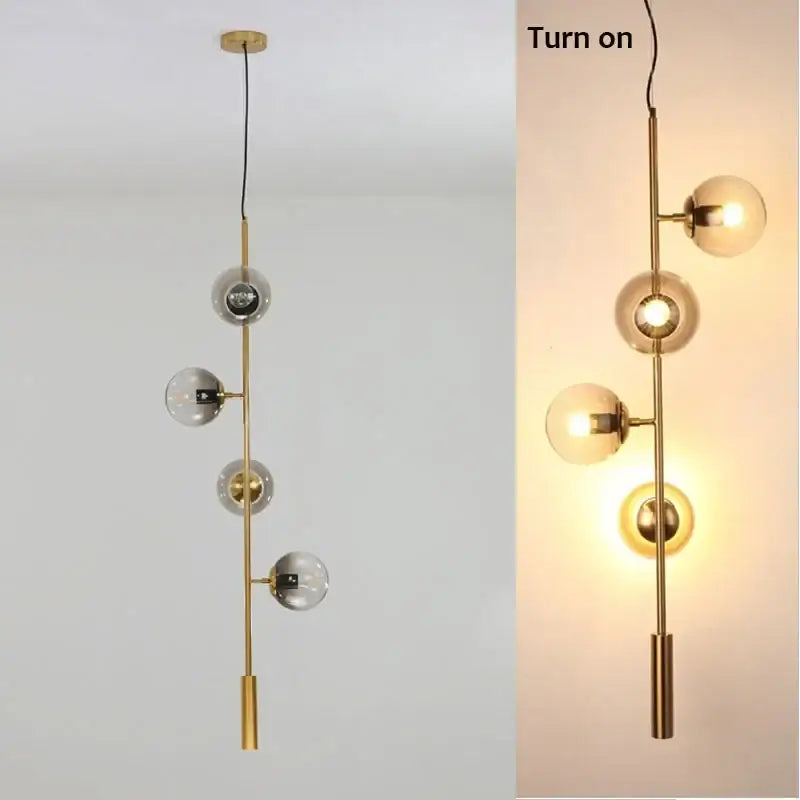 Modern black glass ball pendant light with gold-toned rod and clear and frosted glass spheres for living room decorbites chandelier