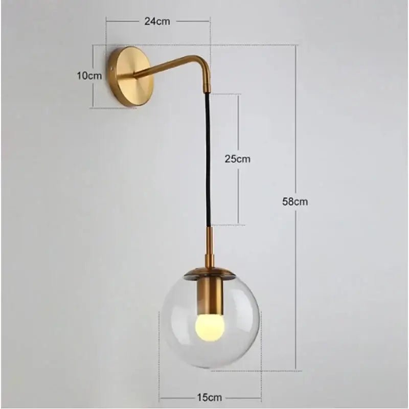 Gold-toned wall sconce pendant light with clear glass globe and black cord for modern chandelier decorbites glass ball design