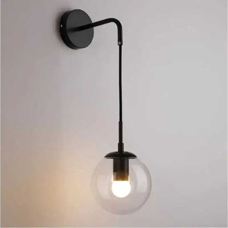 Modern black metal pendant light with clear glass globe and illuminated bulb for stylish decorbites glass ball chandelier