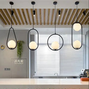 Set of four modern black metal pendant lights with frosted glass ball shades decorbites glass ball pendant for dining room