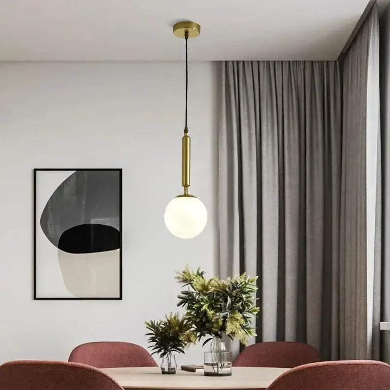 Gold-toned decorbites glass ball pendant lights with frosted glass bulb and cylindrical metal stem for dining room set of 4