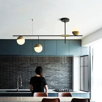 Modern black glass ball pendant lights with brass accents featuring three spherical globe shades for dining room decorbites glass ball pendant
