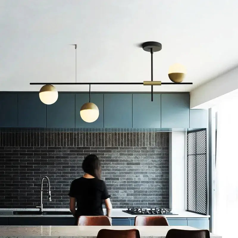 Modern black glass ball pendant lights with brass accents featuring three spherical globe shades for dining room decorbites glass ball pendant