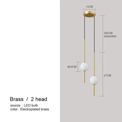 Modern black glass ball pendant lights featuring brass fixture with two white glass shades and adjustable height for dining room decorbites glass ball pendant