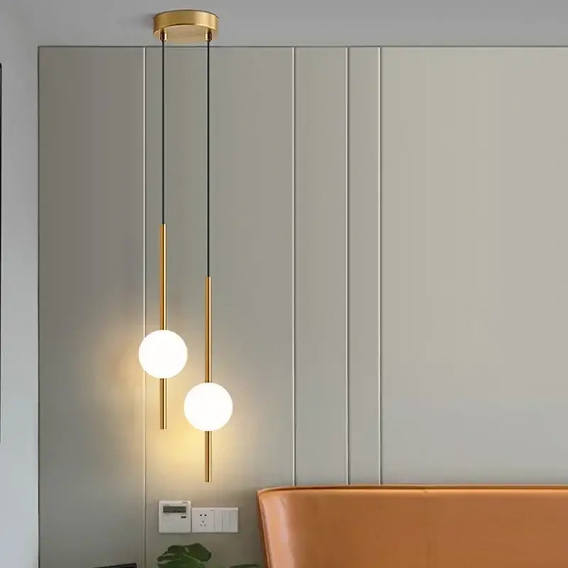Modern black glass ball pendant lights with gold-toned fixture and frosted glass bulbs for dining room decorbites glass ball pendant