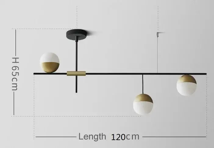 Modern black glass ball pendant lights feature a black metal frame with gold accents and white and gold glass ball pendant shades