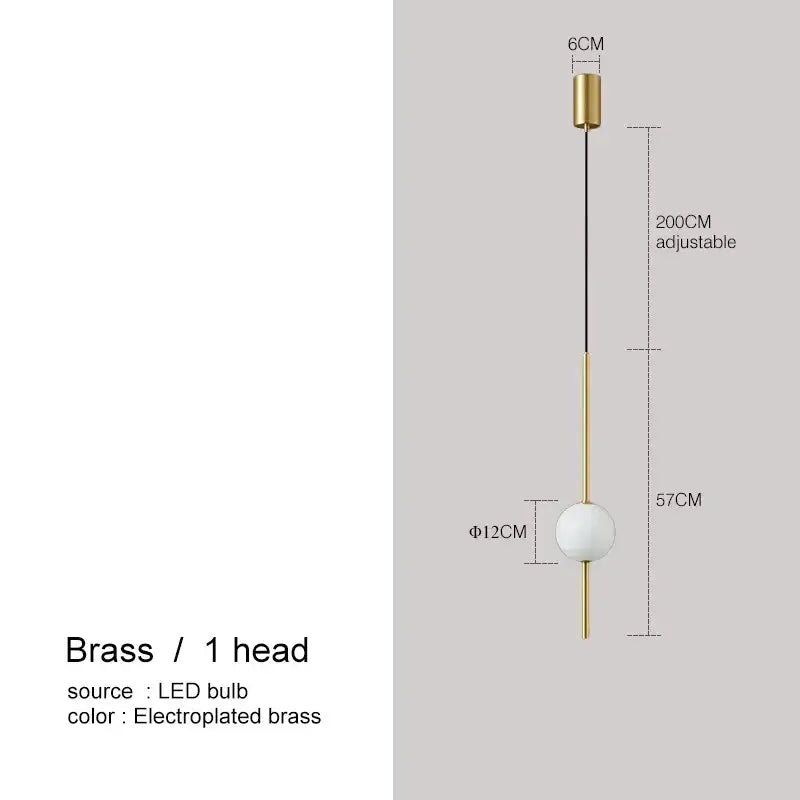 A sleek brass pendant light with a spherical white glass bulb and adjustable cable for modern decorbites glass ball pendant lights