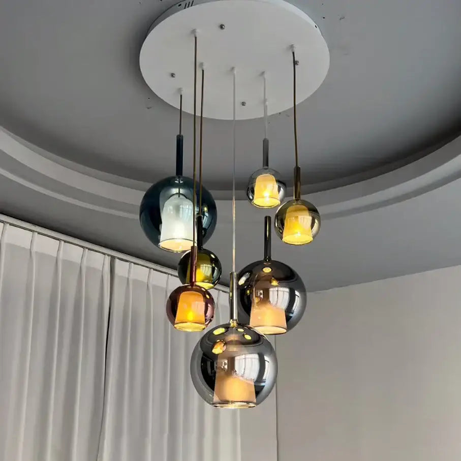 Modern black glass ball pendant lights with reflective metallic finishes in black gold and silver for kitchen island decorbites glass ball pendant