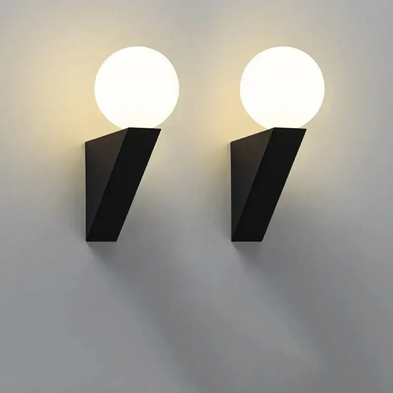 Modern black glass ball wall lamp with glowing white spherical shades wall sconce for bedroom lighting