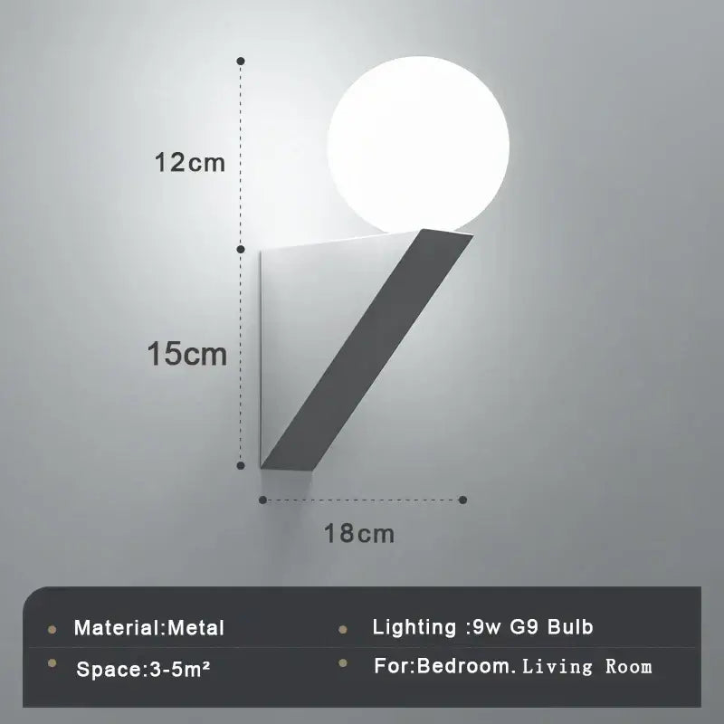 Modern black glass ball wall lamp wall sconce with sleek metallic base and glowing white spherical bulb for bedroom